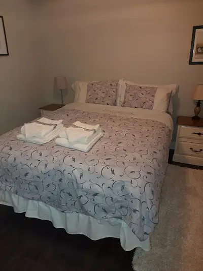 With nightstands and closet